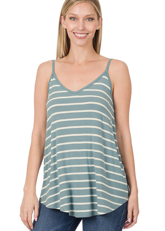 Woman wearing a blue and white striped tank top on a white background