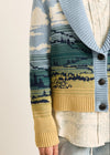 Patterned cardigan with blue, green, and beige colors on a neutral background