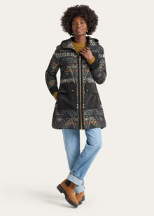  Person wearing a patterned coat on a white background