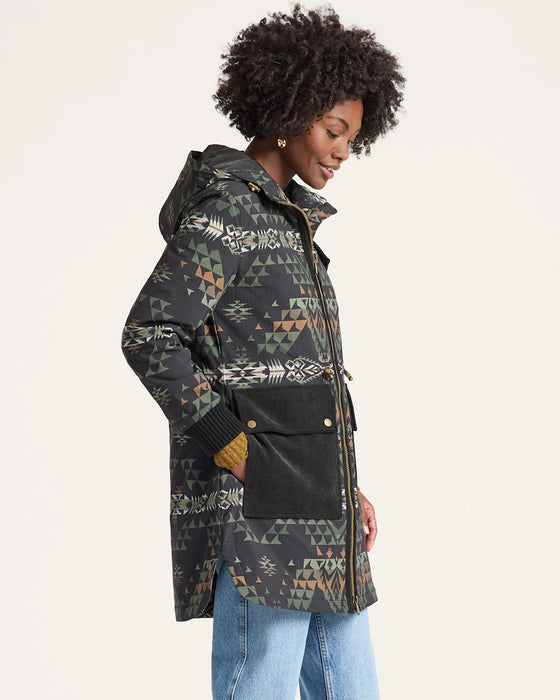 Person wearing a patterned jacket on a white background