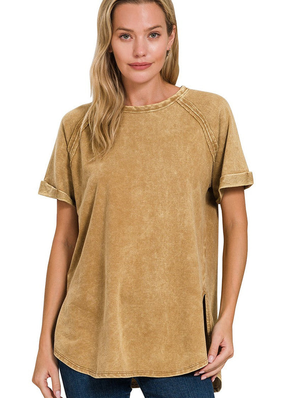 Woman wearing a camel-colored t-shirt on a white background
