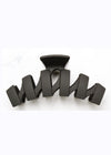 Black hair clip on a white background