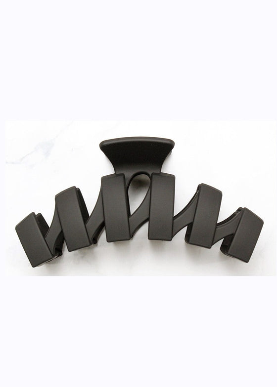 Black hair clip on a white background