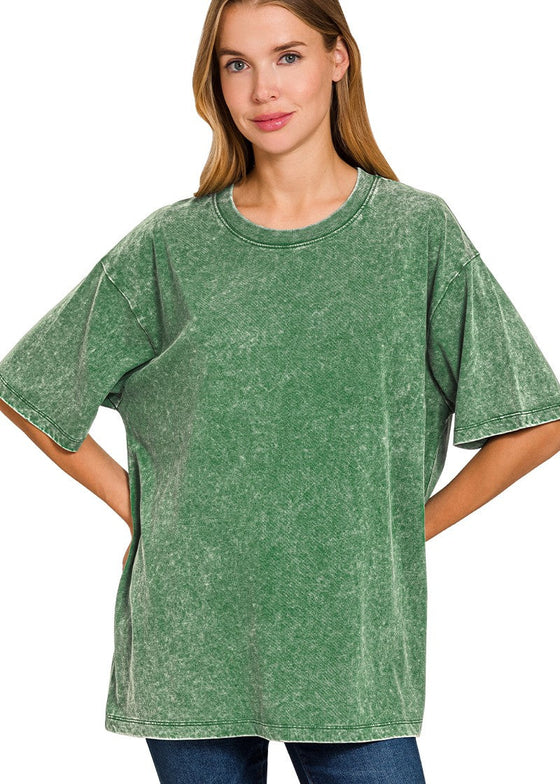 Woman wearing a dark green oversized t-shirt on a white background