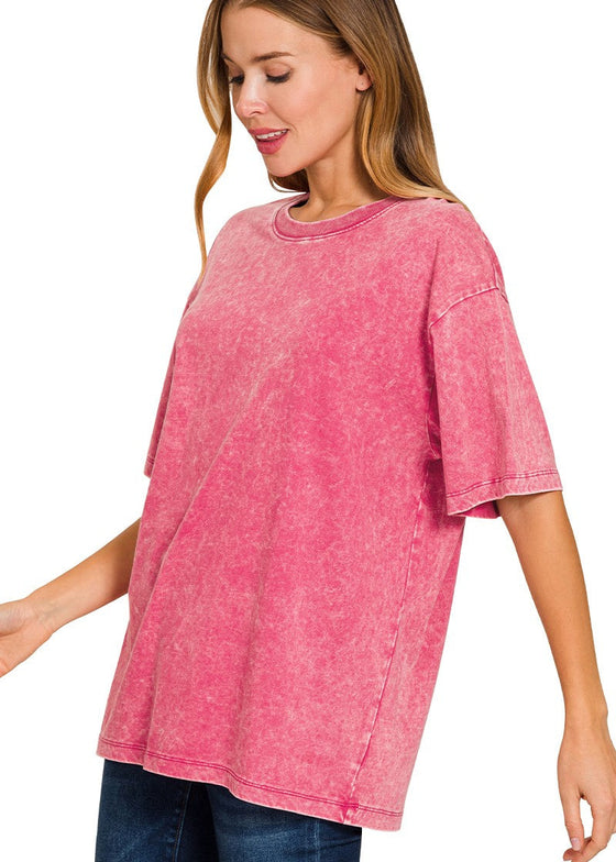 Woman wearing an ash pink t-shirt on a white background