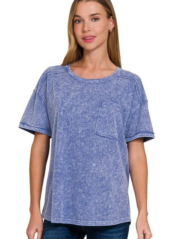 Woman wearing a blue acid-wash t-shirt on a white background