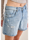 Light blue denim shorts with distressed details on a plain background