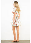 Woman wearing a floral dress on a white background