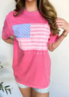 Person wearing a pink t-shirt with an American flag design on a white background