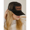 Black cap with orange text worn by a person, against a neutral background