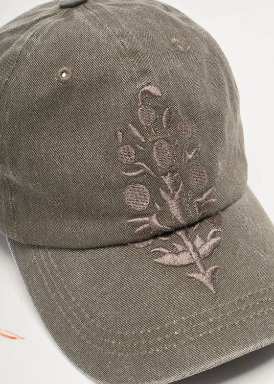 Gray cap with floral embroidery on a white background