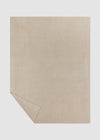 Beige textured blanket on a white background