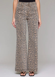  Leopard print pants worn by a person on a plain background