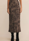 Person wearing a leopard print skirt on a beige background