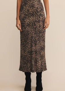  Person wearing a leopard print skirt on a beige background