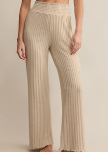 Beige ribbed pants worn by a person on a beige background