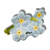 Floral hair clip with light blue flowers and yellow centers on a white background