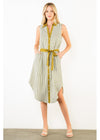 A woman modeling a sleeveless button-front midi dress with vertical stripes in off-white and olive green, featuring olive green trim, a matching tie belt at the waist, and a side slit, photographed against a plain white studio background.