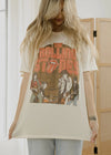 Person wearing a 'The Rolling Stones' t-shirt in a casual setting